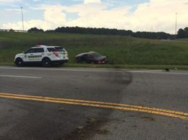 A police car is parked on the side of the road.