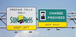 A highway sign with a sign that says prepare tolls only provided.
