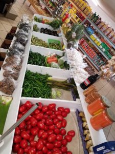 produce products inside store in wooden bins