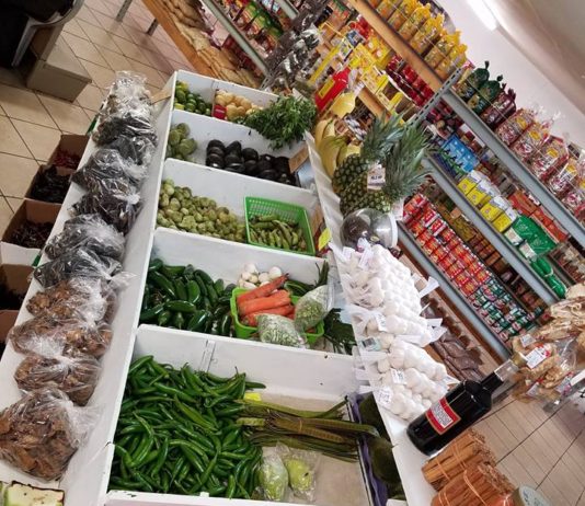 produce products inside store in wooden bins
