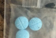blue pills in blastic bag.