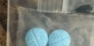 blue pills in blastic bag.