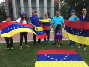 Venezuelans in the U.S. holding Venezuelan flags