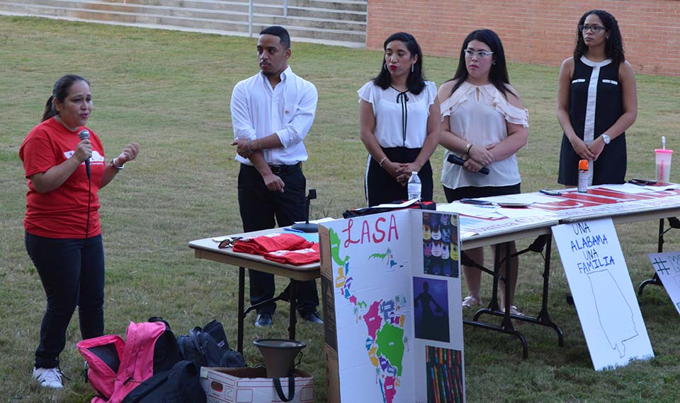 students speak in front of audience