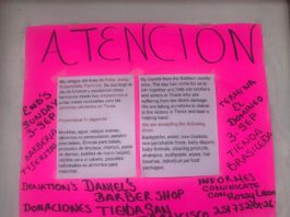 A pink poster with a sign that says attention.