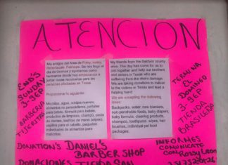 A pink poster with a sign that says attention.