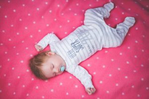 Sleeping baby with pacifier