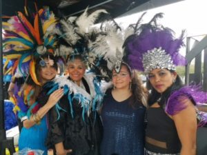 four women dressed in carnaval costumes