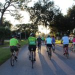 six people riding bicicles