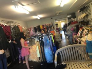 women shopping in clothing shop