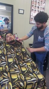 man getting beard trimmed