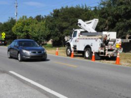 Traffic slowing for utility workers