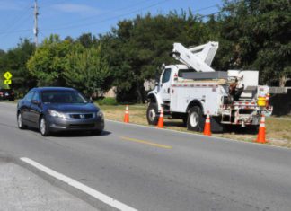 Traffic slowing for utility workers