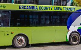 green bus with words "Escambia County Area Transit"