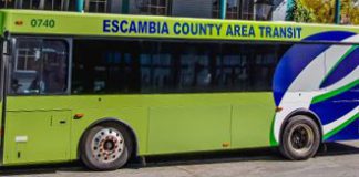 green bus with words "Escambia County Area Transit"