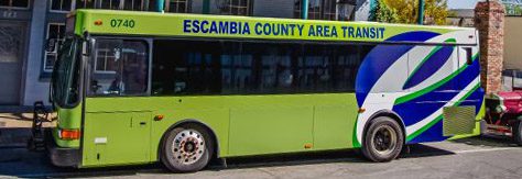 green bus with words "Escambia County Area Transit"