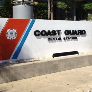 building sign that says "Coast Gurad Destin Station"