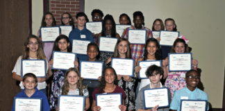 large group of students holding certificates