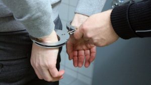 man's hands in handcuffs