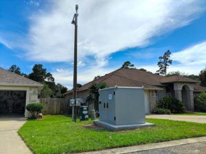 Large electrical box installed between two houses
