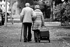 elderly couple walking in the cold