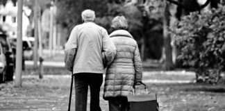 elderly couple walking in the cold