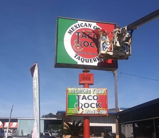 new business street sign that says taco rock