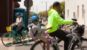 man and child on bicycle