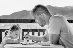 man helping child with homework