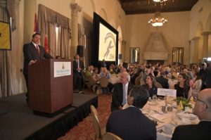 Florida Governor DiSantis speaking from podium at banquet