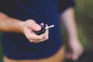 Man offering car key