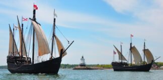 two old ship replicas on the water