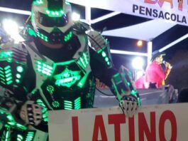 robot holding sign that says "latino festival"
