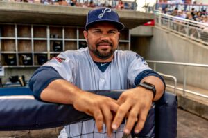 baseball player standing in a dugout