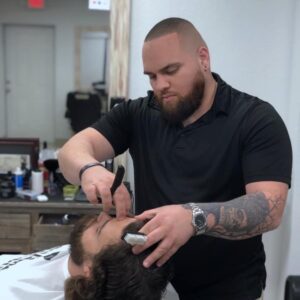 barber shaving a client