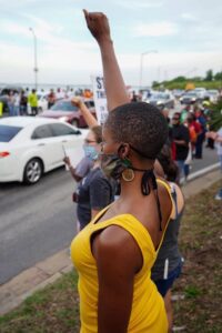 protester holding a fist up