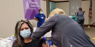 nurse receiving vaccine
