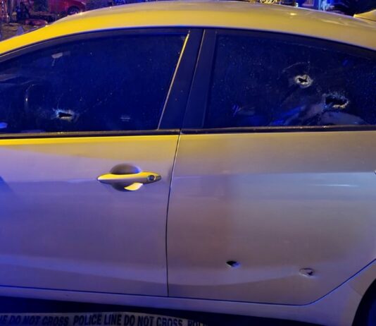 car with bullet holes in rear doors