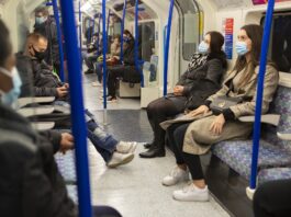 People on public transportation wearing masks
