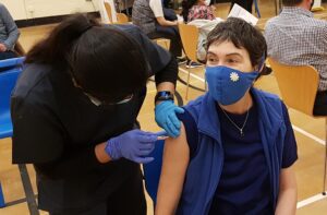 Person receiving a vaccine injection