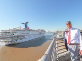 Mayor Stimpson standing next to Carnival ship