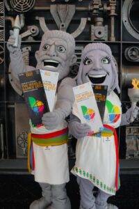 mascots resembling statues holding World Games tickets