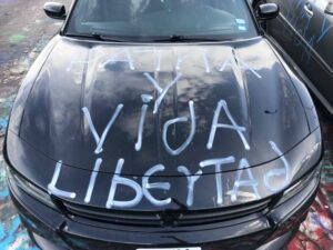 car with words "Patria y Vida Libertad" painted on the hood