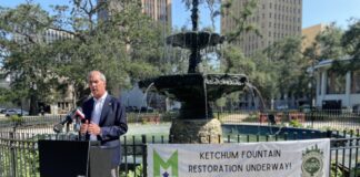 mayor simpson standing next to fountain