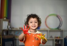 Child with paint on hands