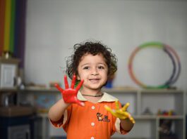 Child with paint on hands