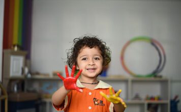 Child with paint on hands