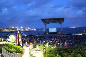 People watching a movie around amphitheater 
