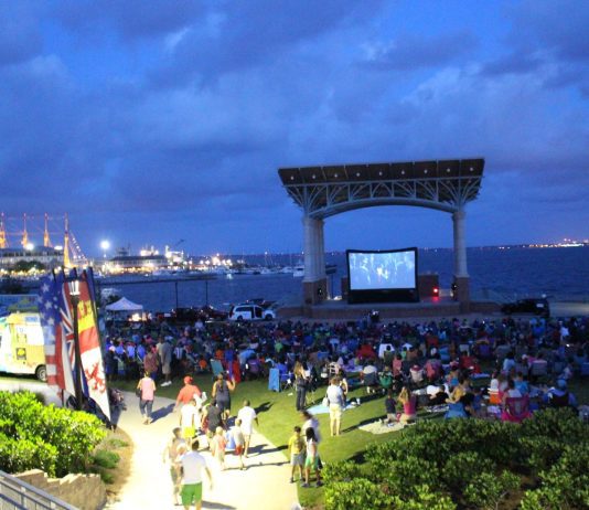 People watching a movie around amphitheater