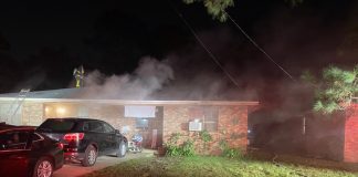 House on fire emitting smoke